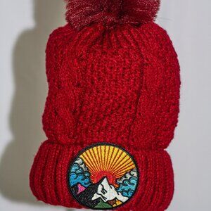 Red stocking cap with "Mountain sunshine" patch and fuzzy lining